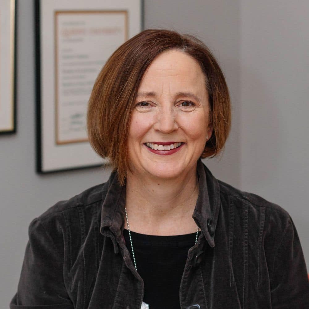 Person with brown hair, wearing jacket