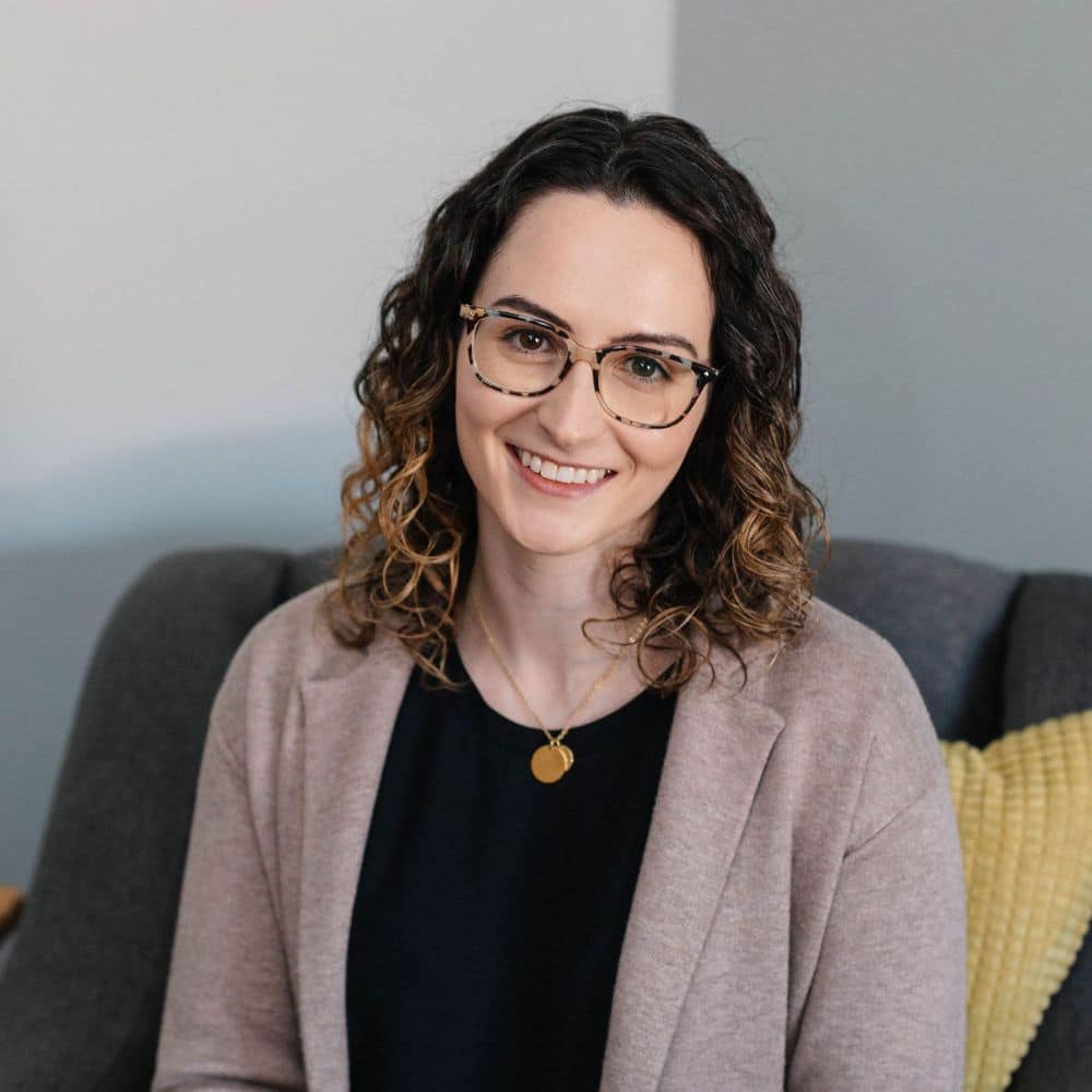 Person with curly hair, casual attire.